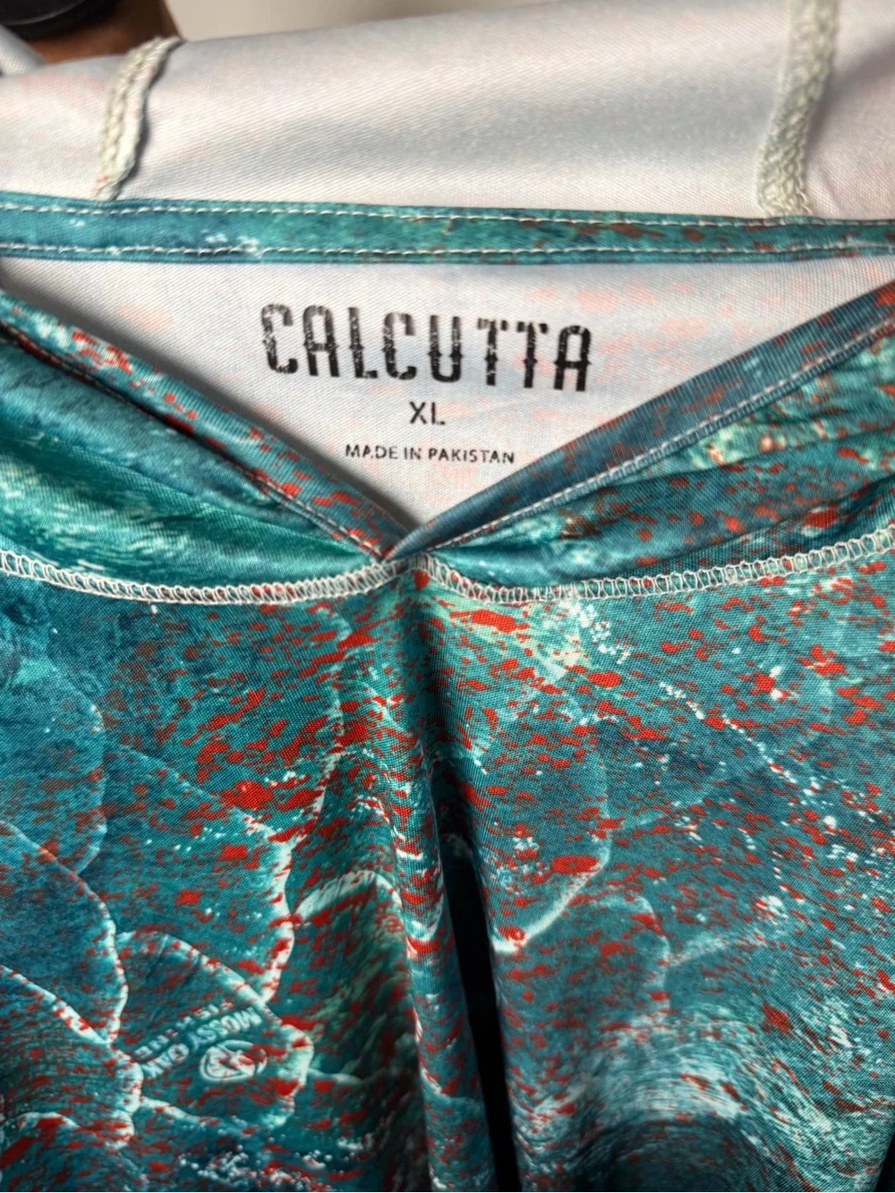 Coastal Performance Hoodie in Teal & Coral by Calcutta